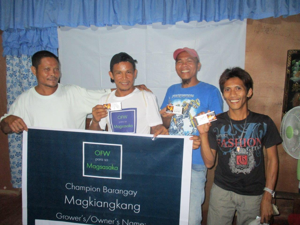 Chocolates and money, what great awards for well performing OPM cacao farmers.  From left to right: (1) Top 2 Improved Farm Winner - Efren Simbahon; (2) In complete OPM uniform including bag and notebook Winner Emmanuel Pelago; (3) General Assembly Early Bird and Top 2 Improved Farm Winner - Dan Pedraza; and General Assembly Early Bird Winner - Elpidio Ruiz.